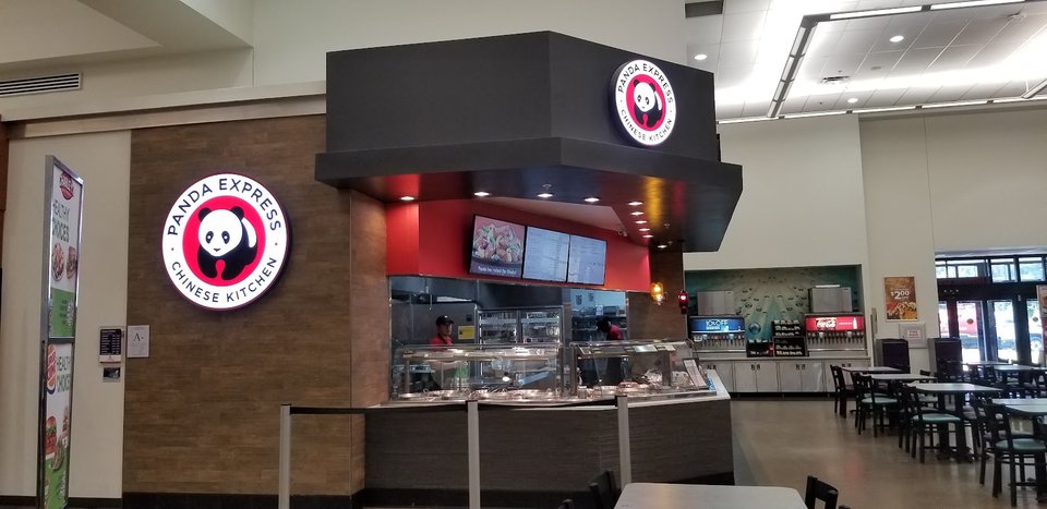 Food court seating with casual tables and chairs.